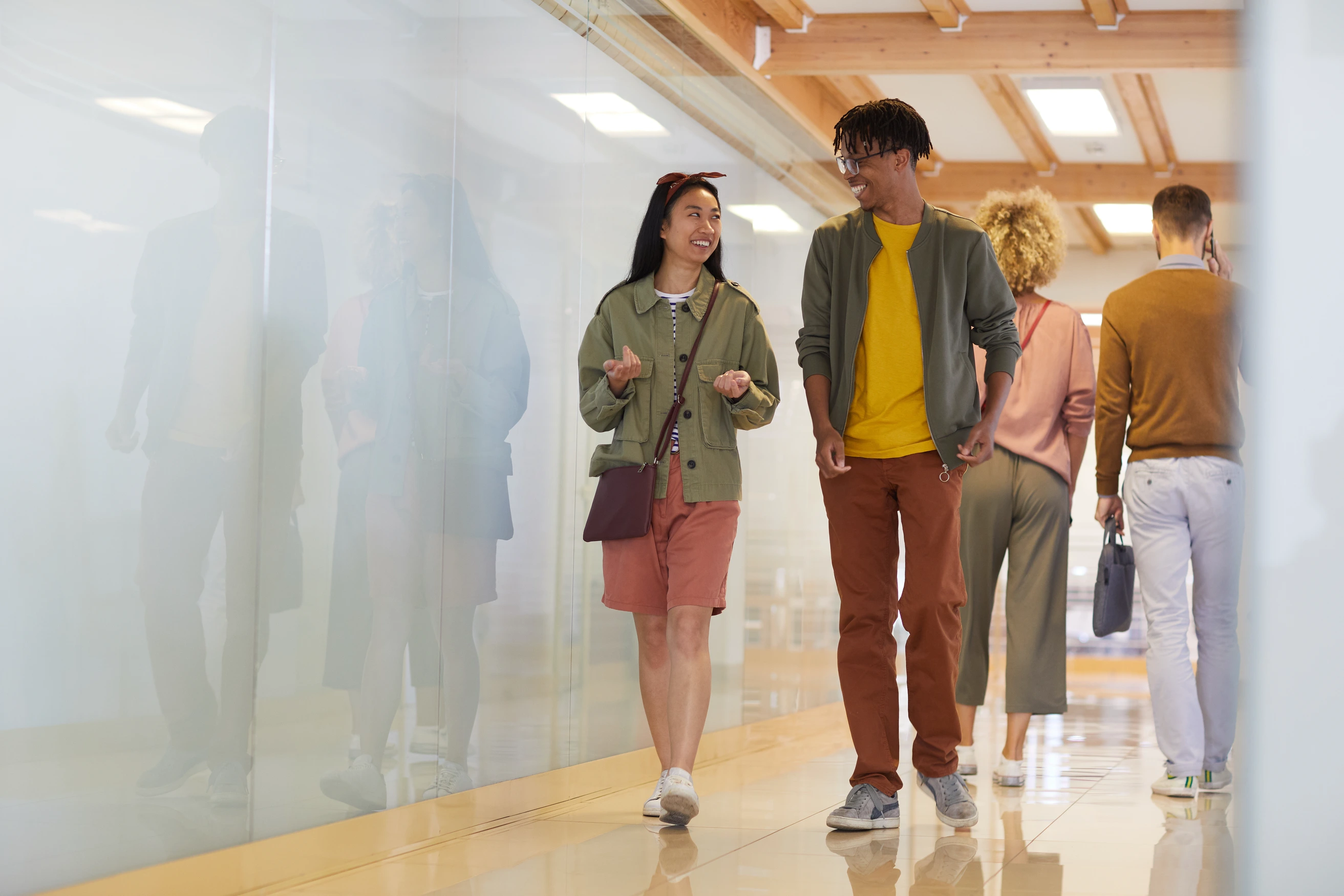 people walk in an exhibition