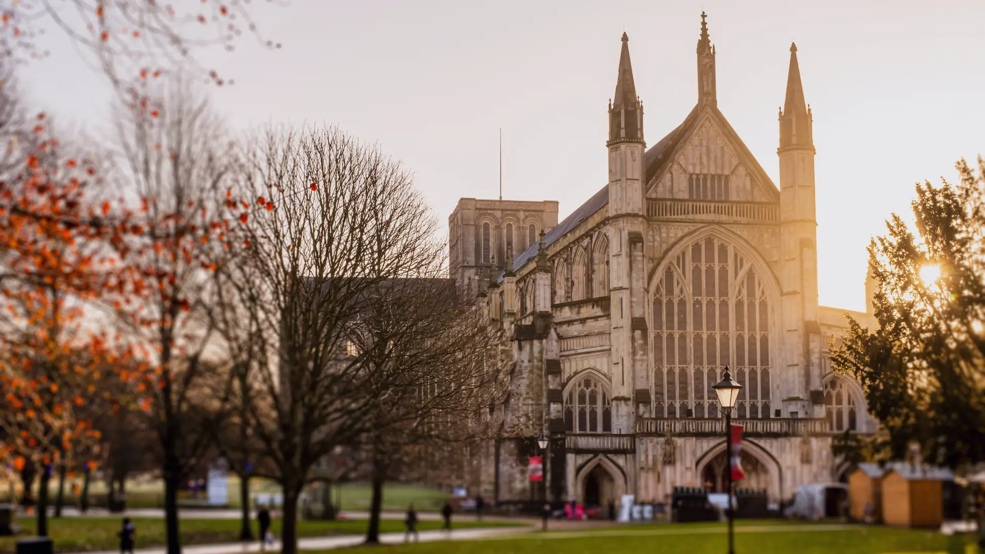 Historic cathedral building at sunrise with warm light shining across the exterior, representing heritage venues and thoughtful modernisation.